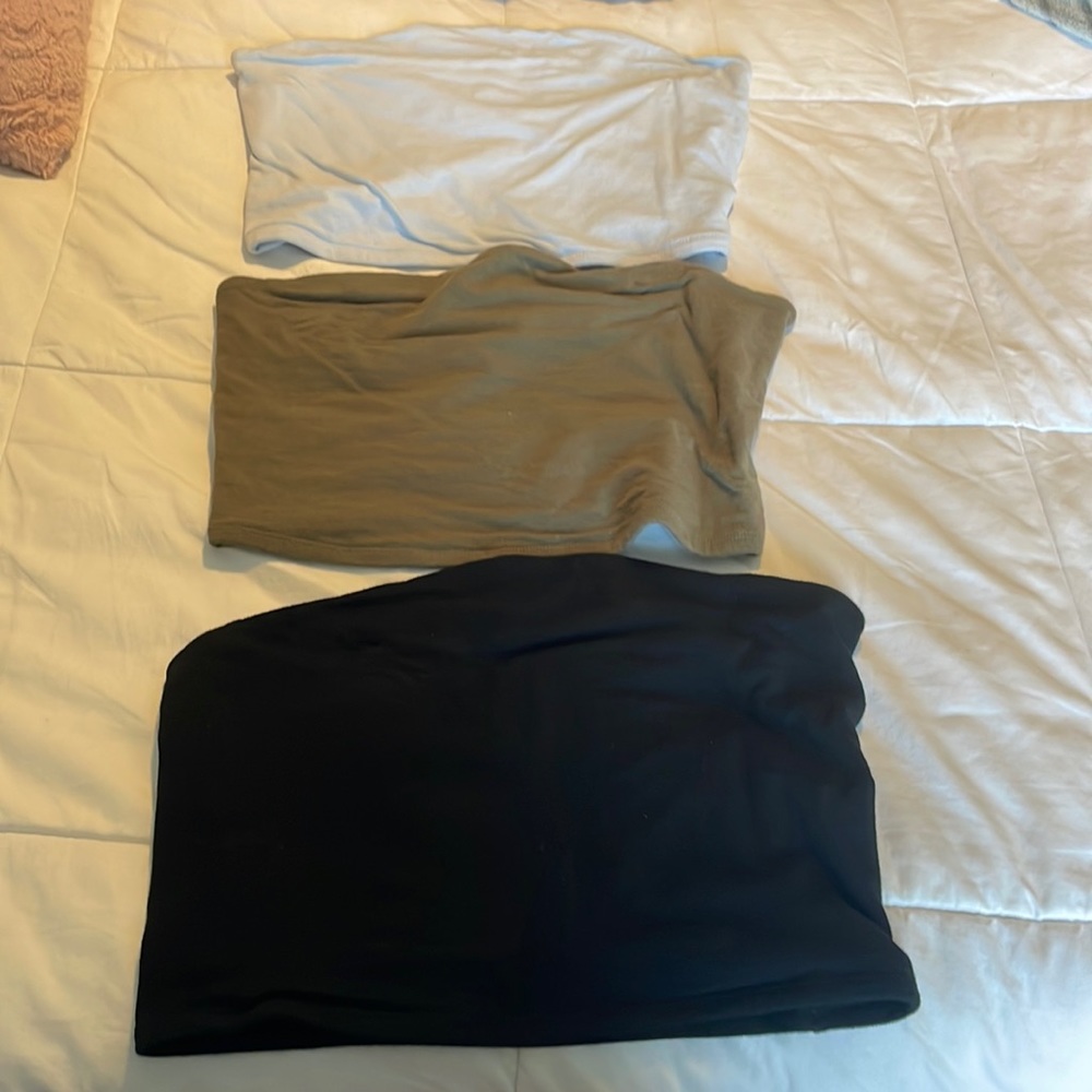 Three black, green, and blue tube tops